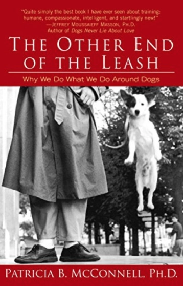 Book cover with man and jumping dog.