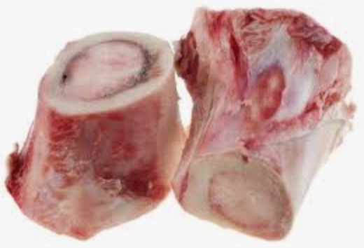 Two raw beef marrow bones.