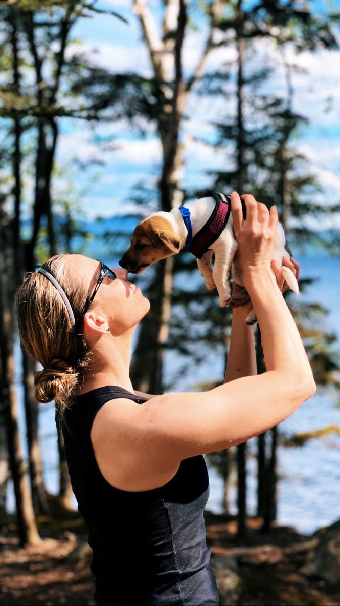 Stephanie (Owner) with a Smithwicks puppy. This is in Rangeley, Maine.